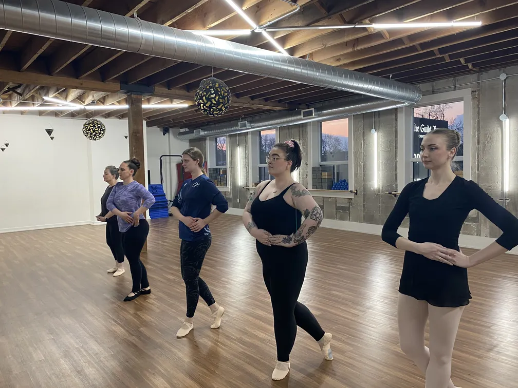 Women partaking in an adult ballet class